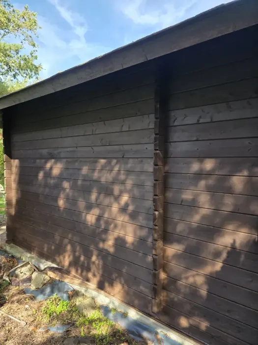 Timber cladding along the side of the cabin