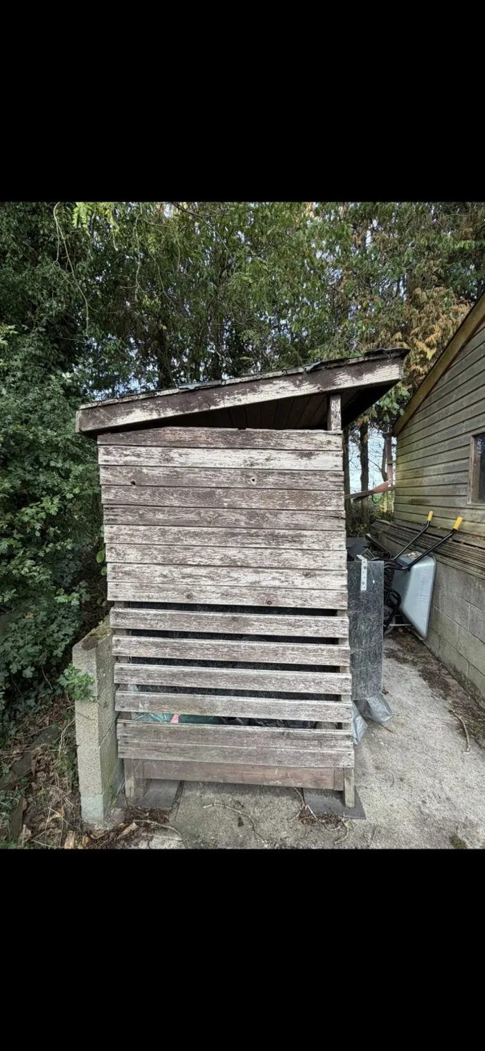 Weathered timber store before work